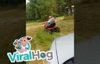 Scaring-Dad-Right-off-His-Lawnmower-ViralHog-attachment